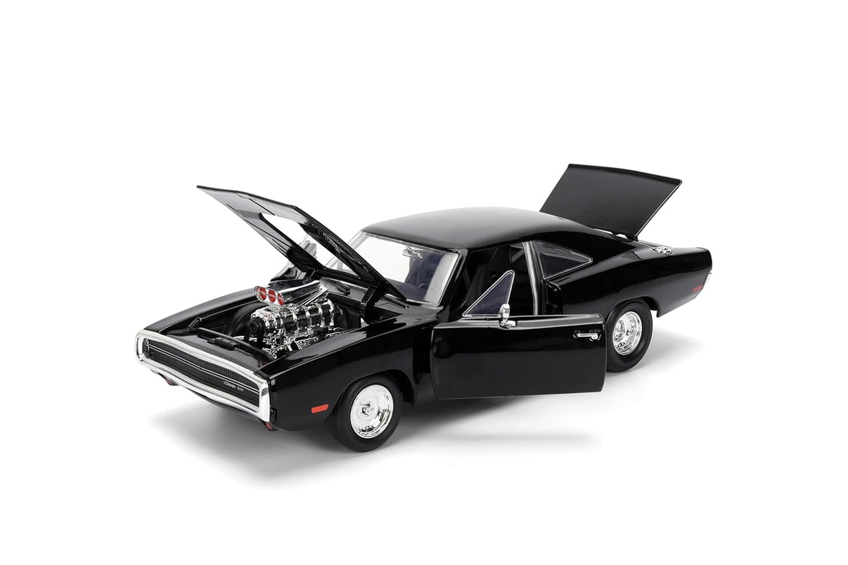 A black die-cast model car, a Dodge Charger from the Fast & Furious franchise, is viewed from the rear passenger side, showing its detailed body, chrome bumper, and distinctive rear lights.