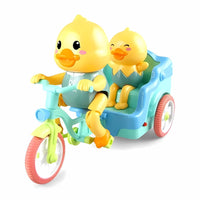 A toy of two yellow ducks riding a light blue and green tricycle with a sidecar is shown against a colorful, cartoon-style cityscape background. Text on the left lists features: "Fun shape," "Eco-friendly plastic," "Guide toddler," and "Children's Colors," each with a small icon.